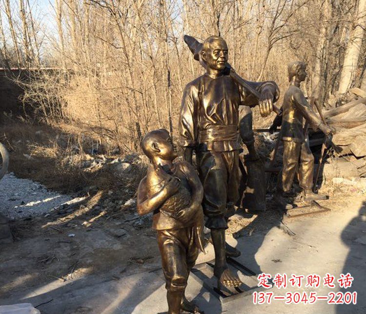 太原抱着鱼的儿童街边小品铜雕