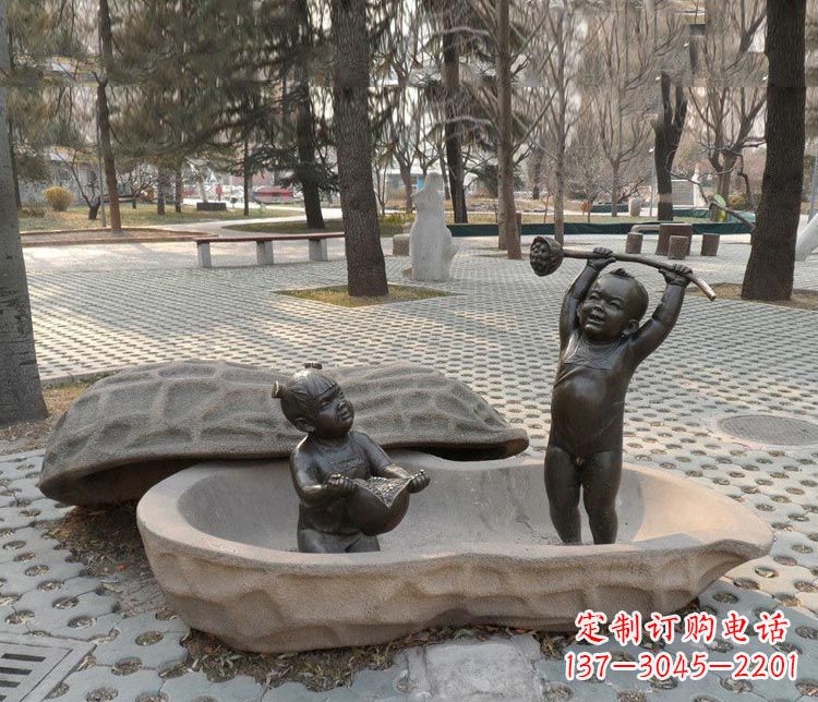 太原拿莲蓬和石榴的小孩铜雕