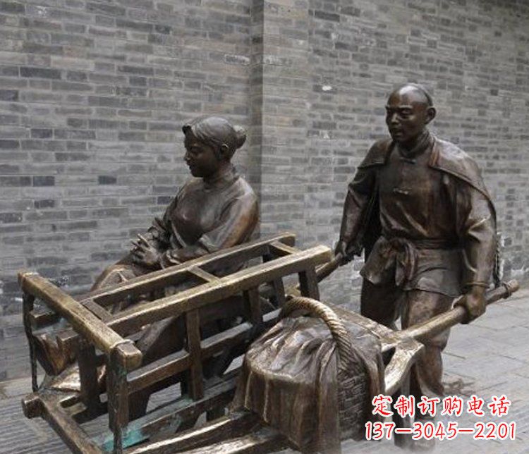 太原推独轮车的人物铜雕