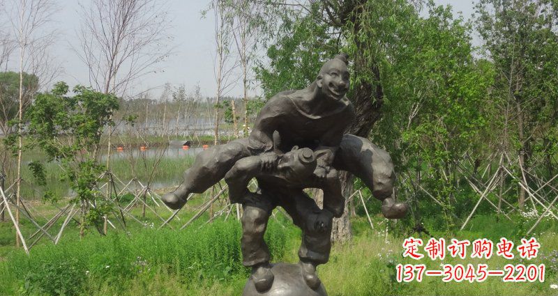 太原园林站在球上面跳山羊的人物景观铜雕